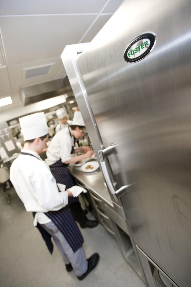 chefs in kitchen environment with Foster fridge