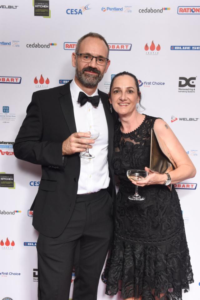 Men and Woman at event holding Champaign glasses