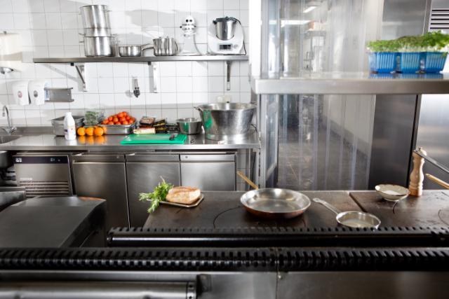 chefs in kitchen environment with Foster Refrigerator equipment and bread