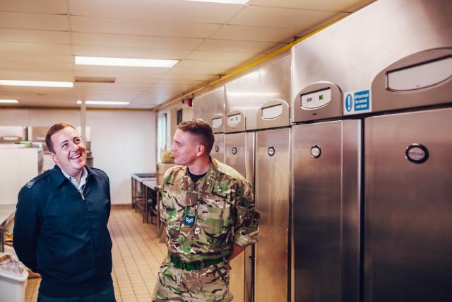 military staff standing near Foster Refrigerator equipment