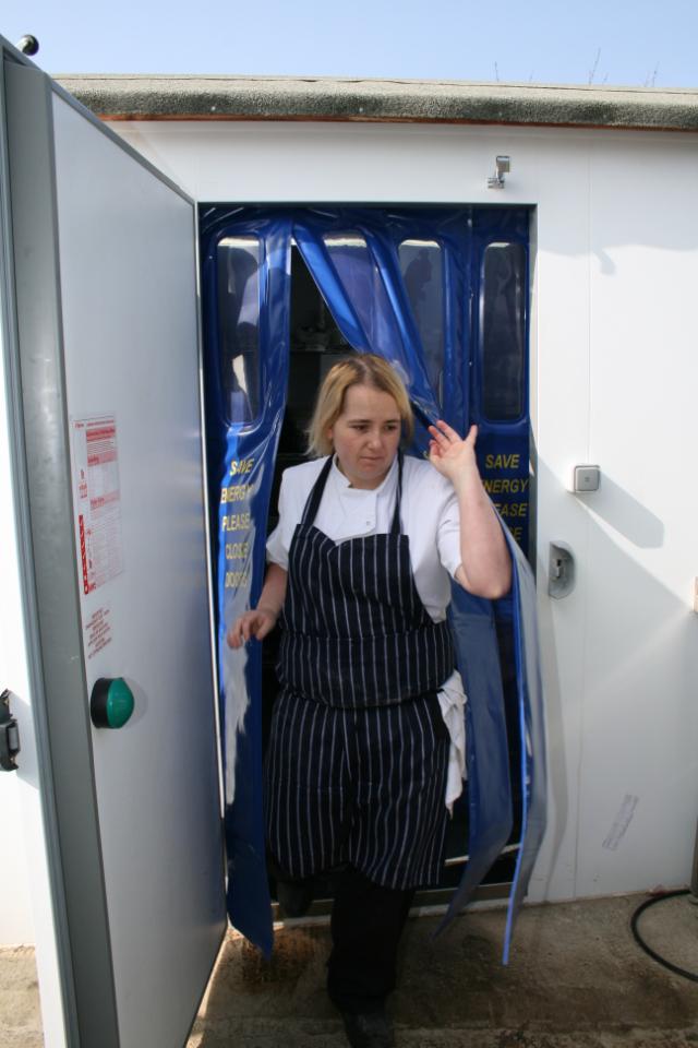 chef coming out of coldroom