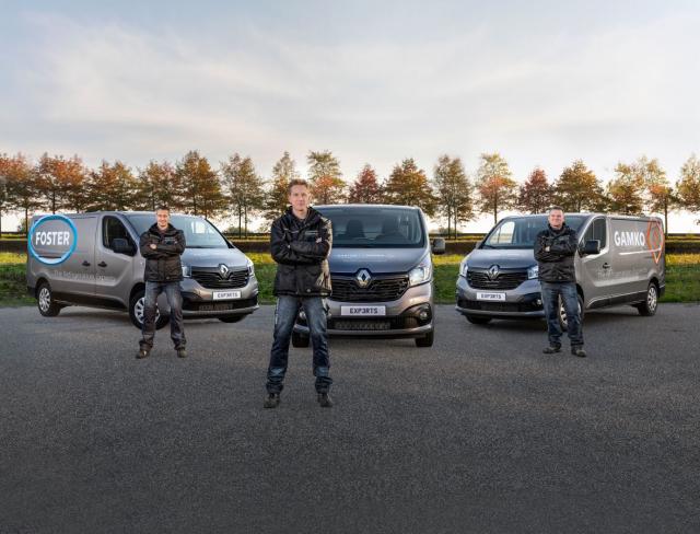 Foster and Gamko service team stand in front of vans