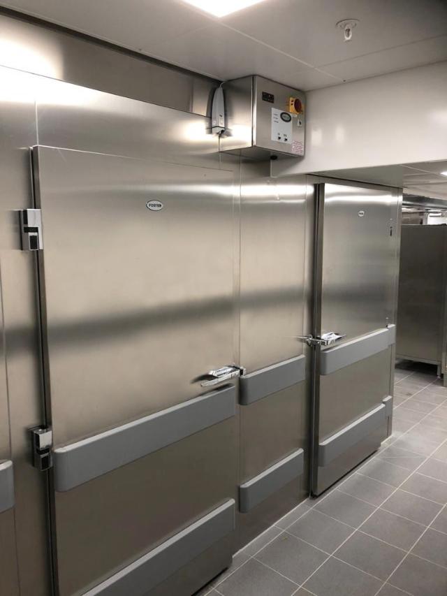 stainless steel finish dual compartment coldroom located in a kitchen environment