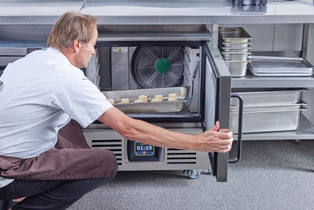 Chef loads tray into blast chiller