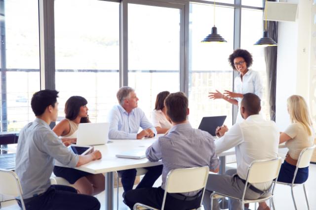 someone presents in a business meeting